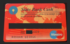 A picture of a State Bank of India Maestro Debit card. The number and dates are redacted.