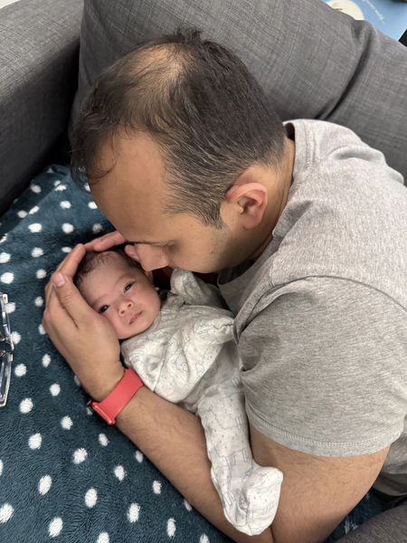 File:Astra and Roshan - Baby refusing cuddles.webp