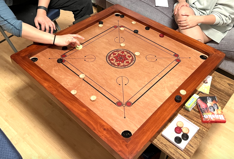 File:Playing Carrom at Roshan and Julie's home.png